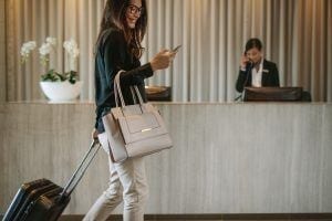 Woman walking past reception at hotel